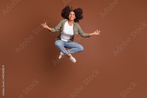 Full body photo of cheerful attractive girl hands fingers meditate look camera isolated on brown color background © deagreez
