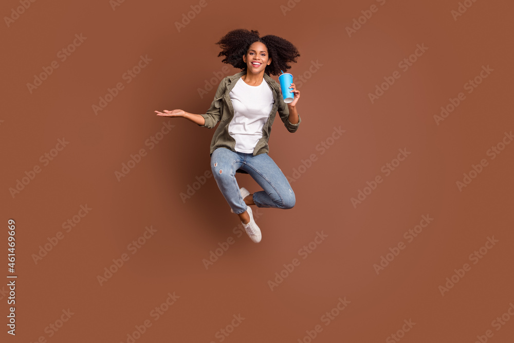 Full size of excited crazy cheerful lady hand hold cup have good mood isolated on brown color background