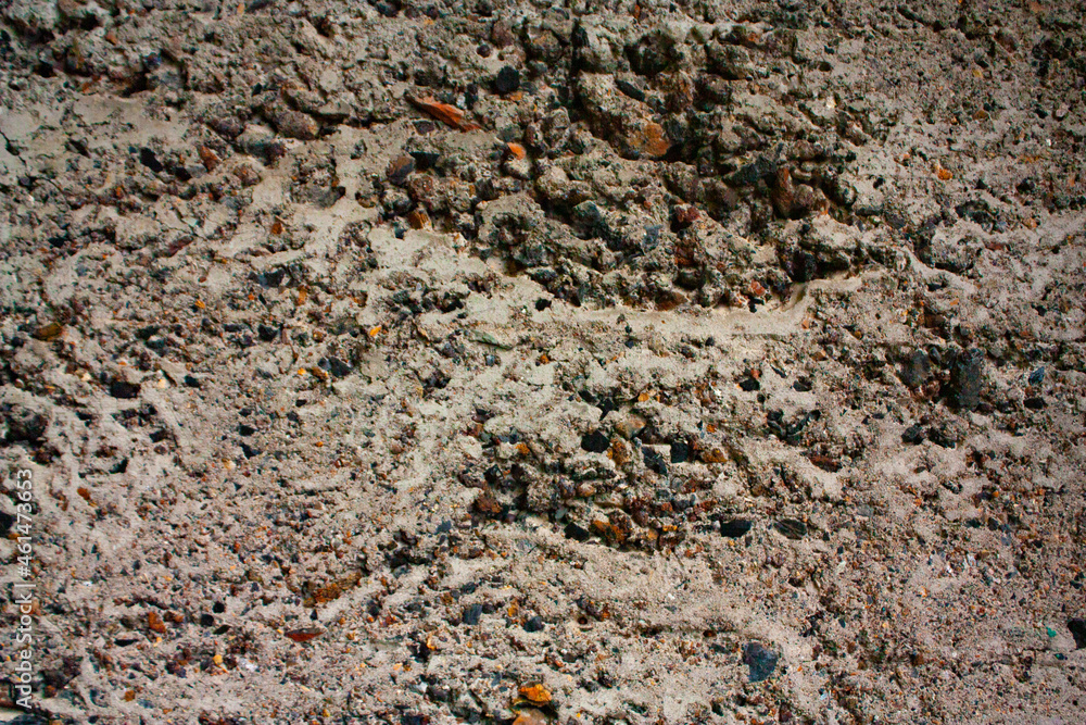 The old cinder-concrete wall is gray with damage and potholes. Gray background with texture.
The old cinder-concrete wall is gray with damage and potholes. Gray background with texture.