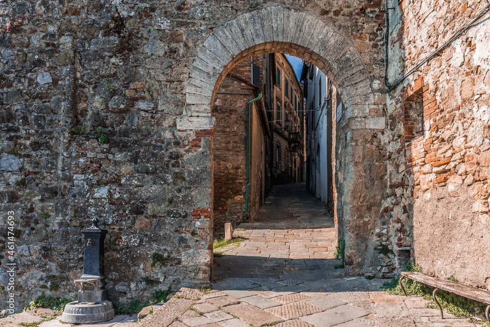Fototapeta premium View of narrow street in Chiusdino, Tuscany, Italy. Copy space.