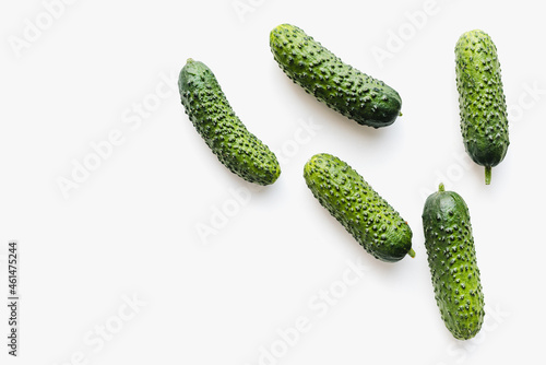 Cucumbers on a white background. Green cucumbers. Pimpled cucumbers. 
