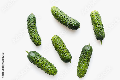 Cucumbers on a white background. Green cucumbers. Pimpled cucumbers. 