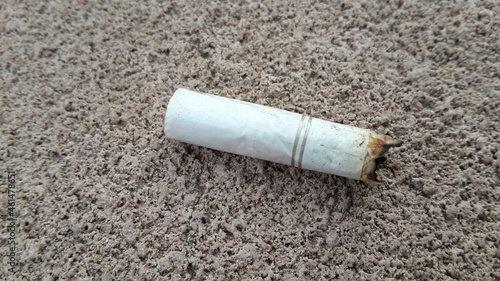 cigarette stub on the ground