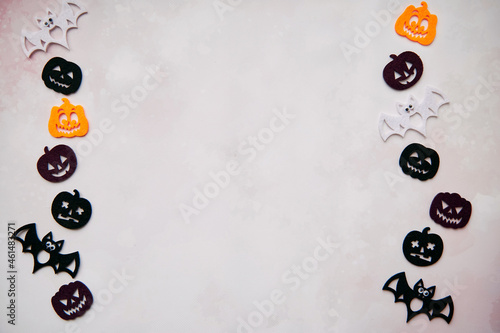 Happy Halloween decorations with bats, cute pumpkins. View from above. Minimalistic holiday concept. Copy space for text. Happy Halloween, trick or treat concept