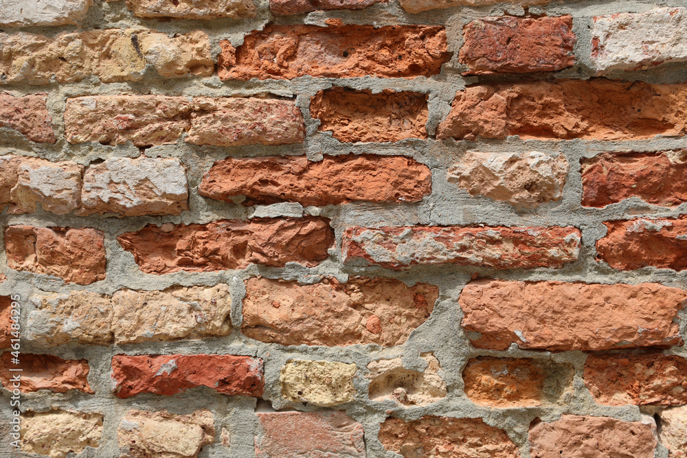 Obraz premium Wall made with lime and terracotta bricks that can be used as a background for a firewall