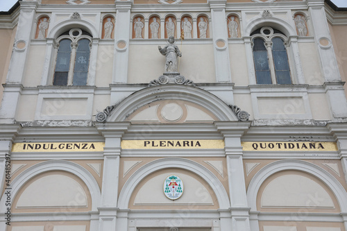 Detail of the big Text on the facade of Church that means Daily plenary indulgence in Italian language photo
