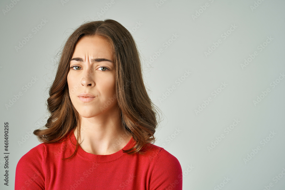 beautiful woman holding on to hair cosmetics light background beautiful woman holding on to hair cosmetics light background
