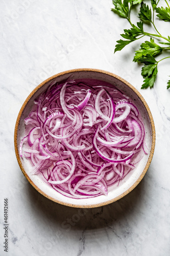 Sliced red onion in a bowl