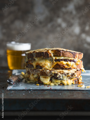 Croque Monsieur server with a lager beer, with copy space