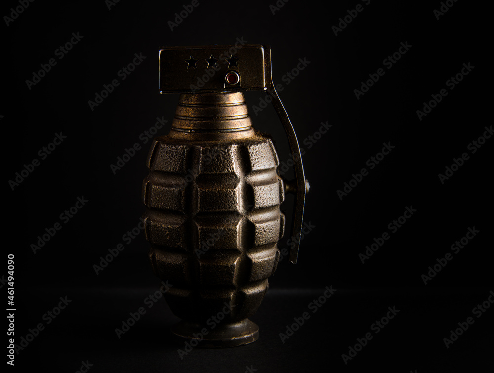 old fake hand grenade on black background . old fake hand grenade on black background .