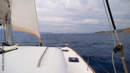 view from the bow of the catamaran yacht cruising by sea, Greece, Europe