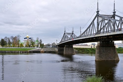 Beautiful urban landscape in Tver with view of Starovolzhsky Bridge on Volga River embankment with palace garden. Сoncept of architecture of a small city. Tver, Russia