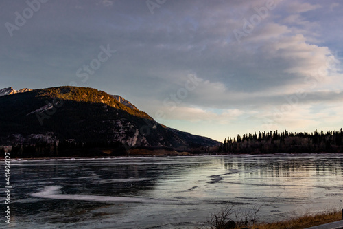 Fototapeta Naklejka Na Ścianę i Meble -  Sun rises over the lake. Lac de Arc, Alberta, Canada