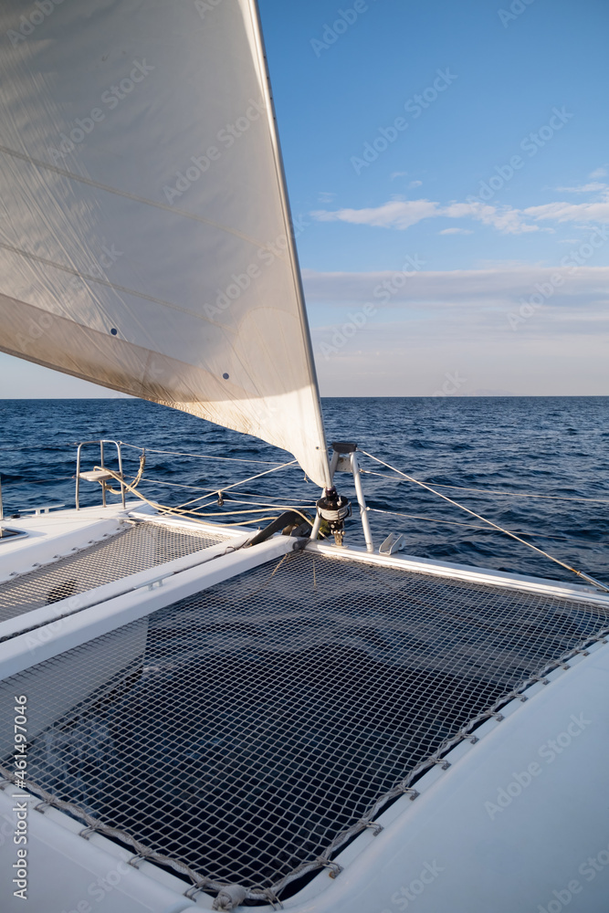 Obraz premium view from the bow of the catamaran yacht cruising by sea, Greece, Europe