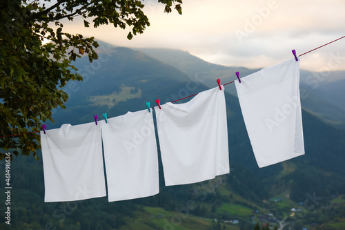 Wallpaper Mural Bedclothes hanging on washing line in mountains Torontodigital.ca