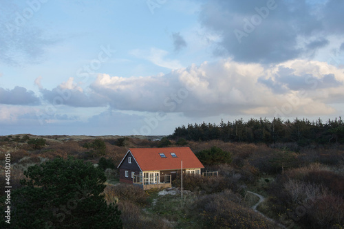vacation house in the dunes of the Wadden isle Vlieland at the end of a sunny day in autumn