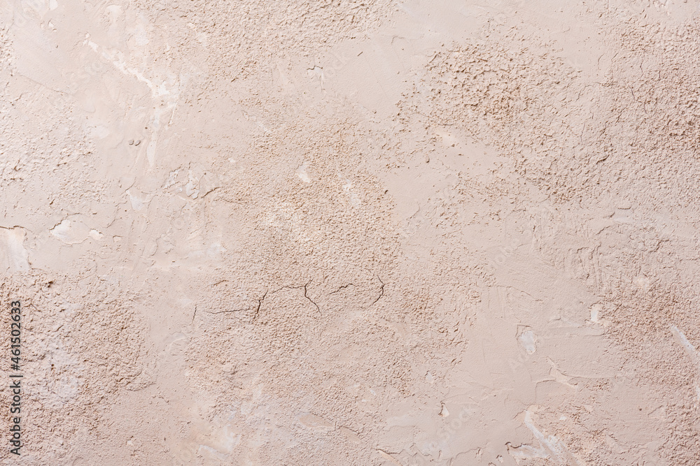 Grunge background with old stucco wall texture of beige color. Grunge background with old stucco wall texture of beige color.