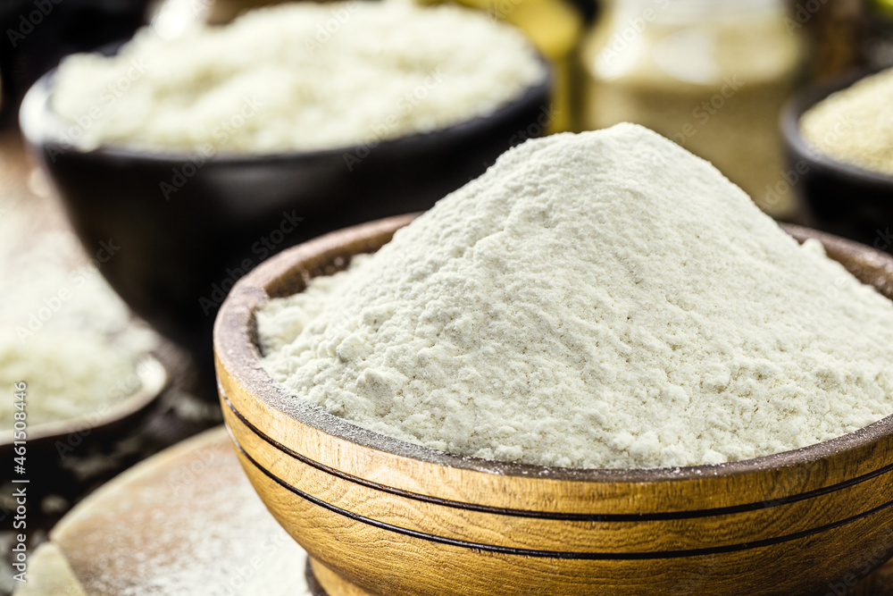 rice flour in a blown-style wooden pot, gluten-free and wholemeal ingredient rice flour in a blown-style wooden pot, gluten-free and wholemeal ingredient
