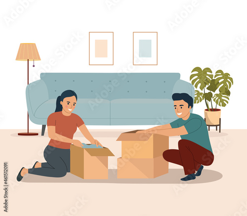 Young couple packing things in boxes together in the living room. Vector illustration