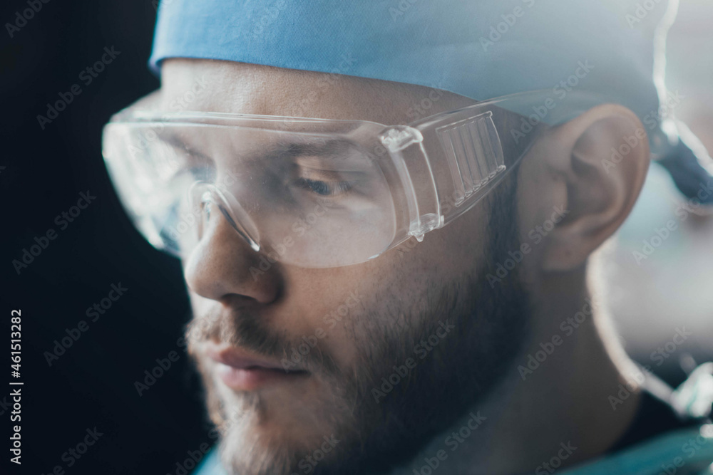 portrait of a male medic in uniform and glasses portrait of a male medic in uniform and glasses