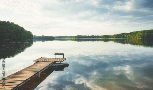 Wooden pier at a calm lake, Poland. photo