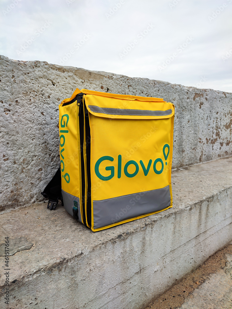 Glovo delivery food bag or thermobag outdoors Stock Photo | Adobe Stock
