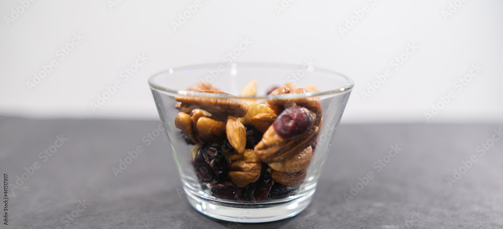 Small class of fresh nuts above black surface Small class of fresh nuts above black surface
