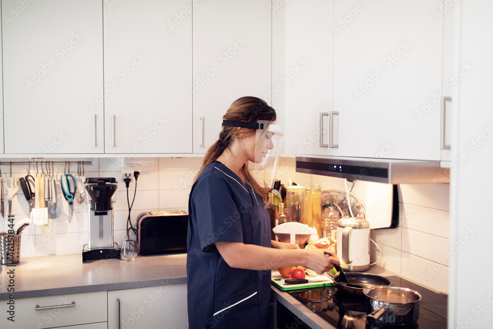 Female career cooking food in kitchen Female career cooking food in kitchen