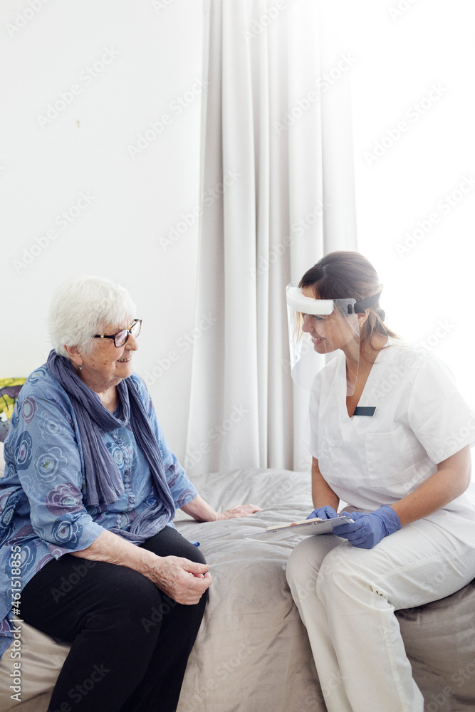 Nurse with elderly woman at home Nurse with elderly woman at home