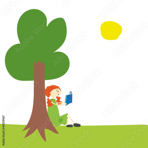 redhead girl reading a book near a tree