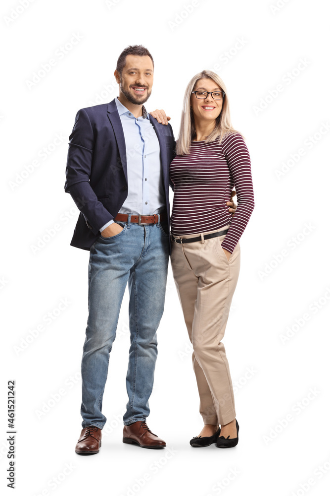 Full length portrait of a young casual couple posing and smiling Full length portrait of a young casual couple posing and smiling