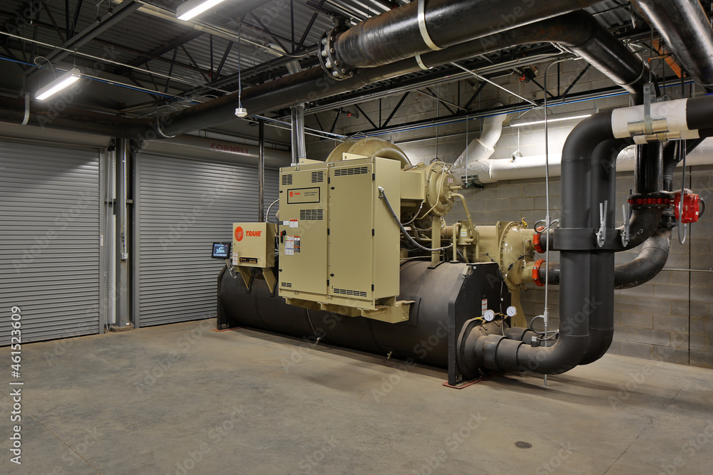 Fototapeta premium Machine generator electric industrial equipment in building basement
