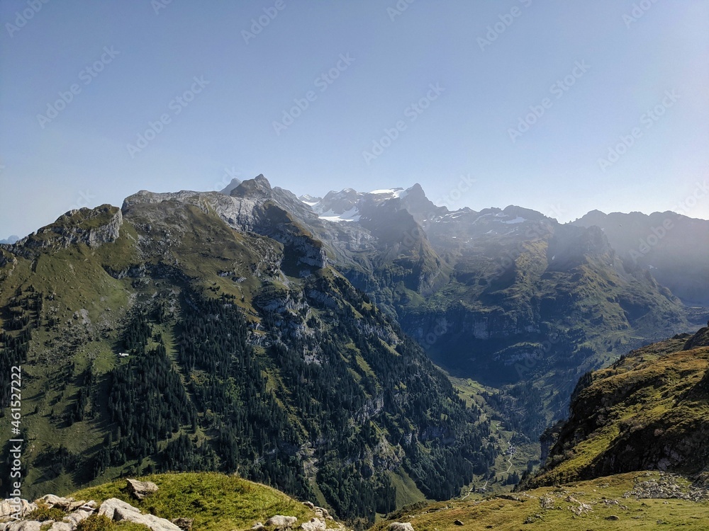 Fototapeta premium hike on the mountain silbern in the canton of uri. away through the beautiful swiss mountains past flower meadows. 