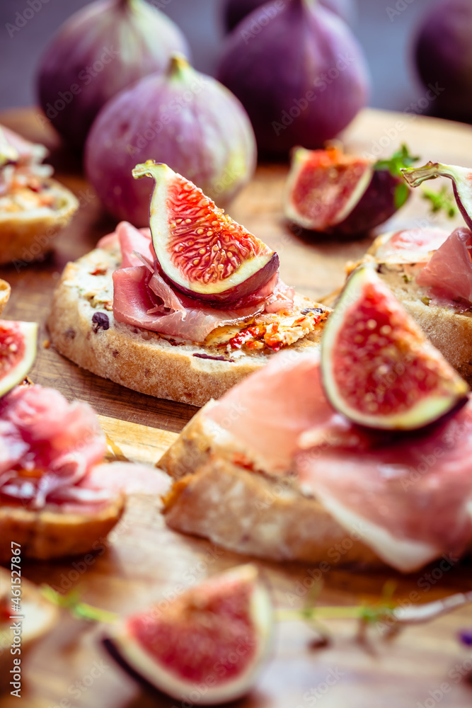 Small open sandwiches with ciabatta, proscuitto and fresh figs Small open sandwiches with ciabatta, proscuitto and fresh figs