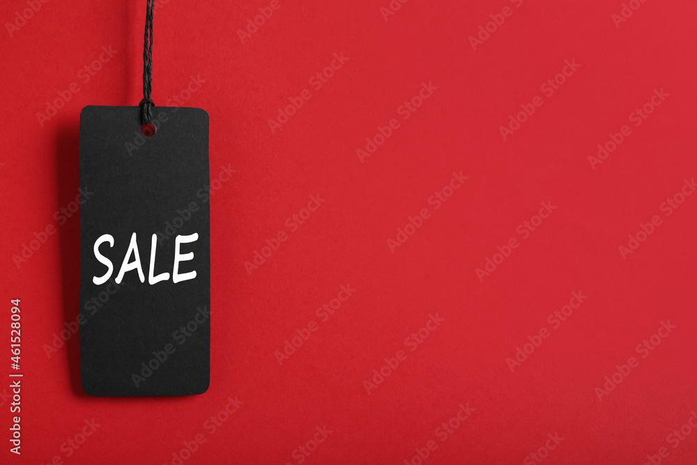 Sale tag on red background, space for text. Black Friday