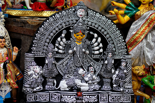 Clay idol of Goddess Devi Durga is in preparation for the upcoming Durga Puja festival at a pottery studio in Kolkata, West Bengal, India. photo