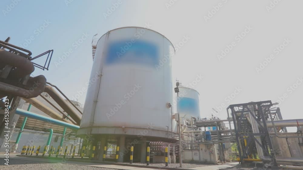 Large storage tanks in the factory. Exterior of a modern factory. White ...