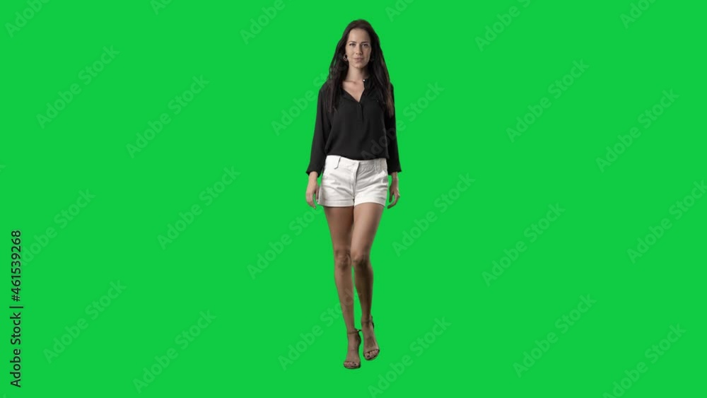 Luxury well-dressed runway fashion model walking in slow motion. Full body on green screen chroma key background Luxury well-dressed runway fashion model walking in slow motion. Full body on green screen chroma key background