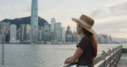 Photography Woman look at the Hong Kong city at sunset time
