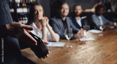 Obraz na plátně Banner Male sommelier conducts red wine tasting for restaurant guests