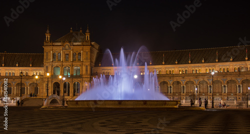 the fountain shines in the night of Seville