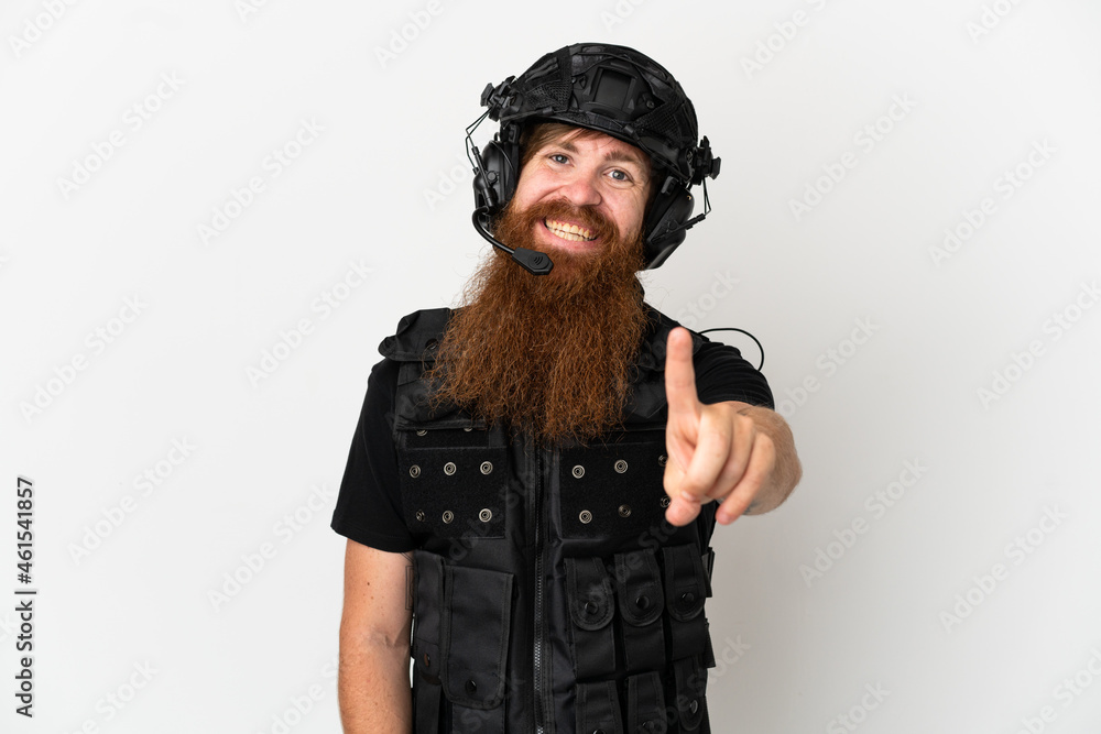 Redhead SWAT isolated on white background showing and lifting a finger Redhead SWAT isolated on white background showing and lifting a finger