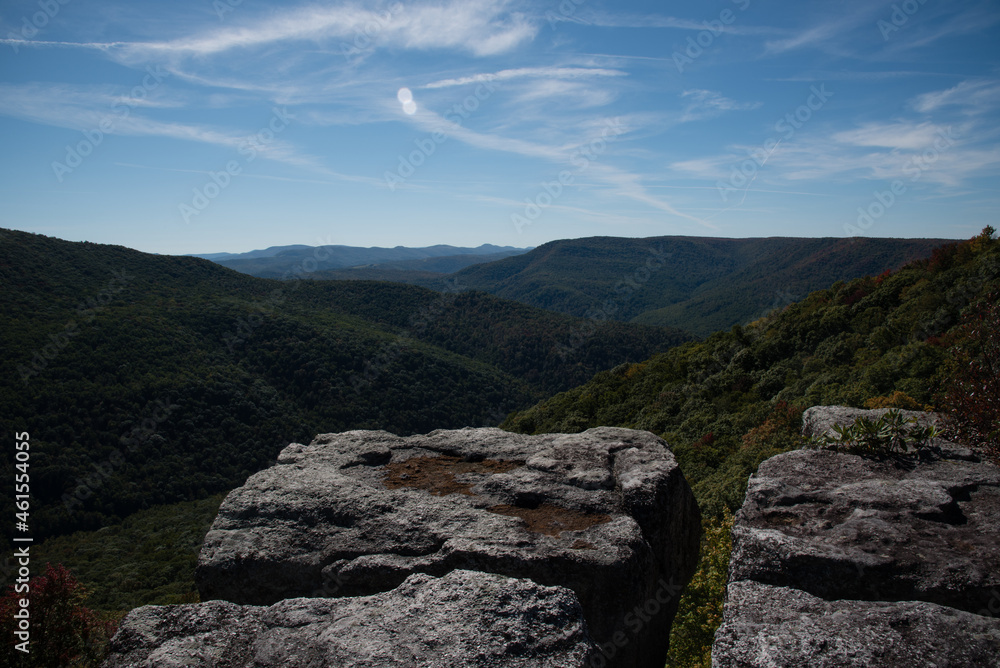 Endless mountain views from a rock cliff at the end of a trail. Endless mountain views from a rock cliff at the end of a trail.