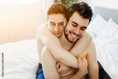 homosexual couple under a bed at home