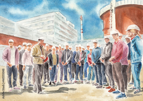 The manager conducts a production briefing of workers before visiting a nuclear power plant.