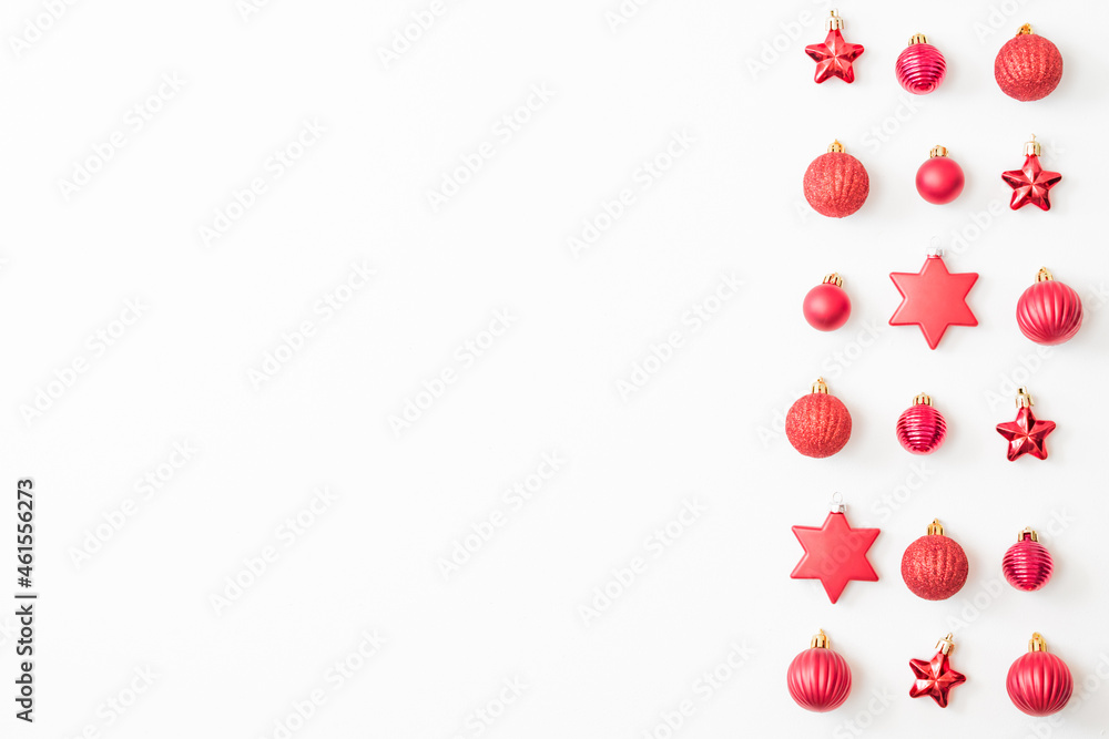 Flat lay pattern with christmas balls and decorations on a white background
