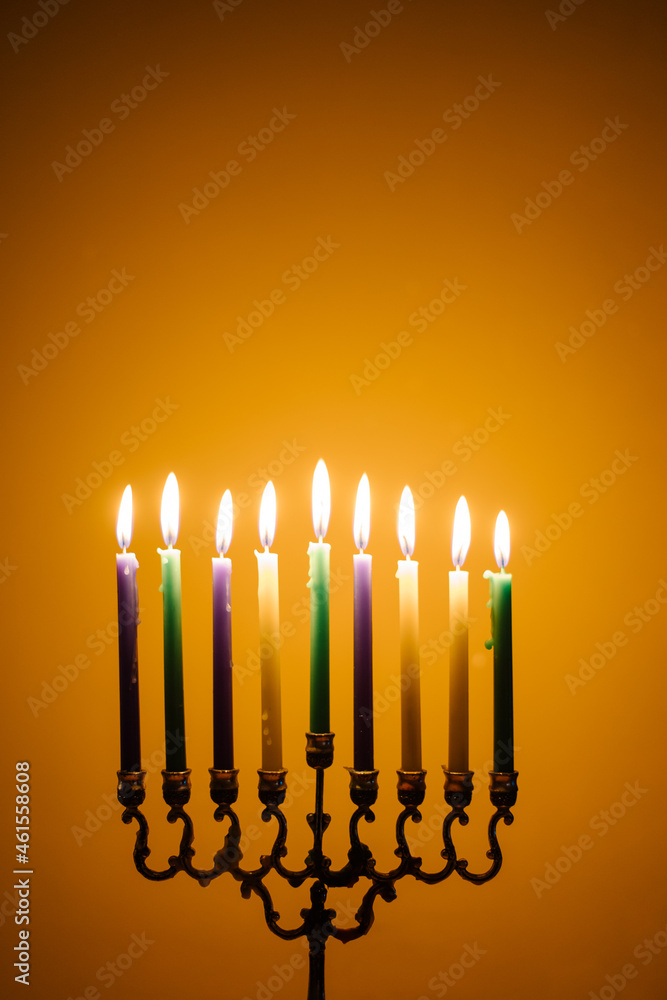 lights the menorah for Hanukkah. Jewish holiday. Tradition is a religious ritual. Sunset. The