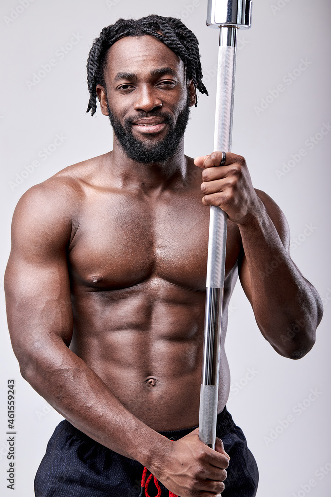 Sport, bodybuilding, lifestyle and people concept. Young and fit man doing workout holdign barbell, smiling, lookign at camera. bodybuilder training with sport equipment, posing isolated on white Sport, bodybuilding, lifestyle and people concept. Young and fit man doing workout holdign barbell, smiling, lookign at camera. bodybuilder training with sport equipment, posing isolated on white
