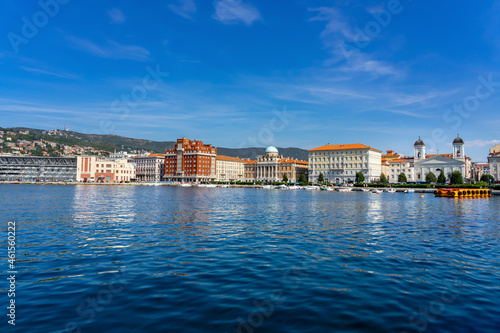 view of the city from molo audace pier in Trieste with beautiful buildings cityscape skyline shore