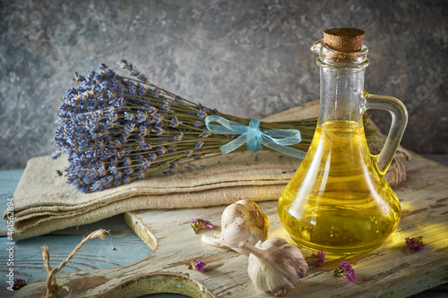 A bottle of organic olive oil on a rustic background